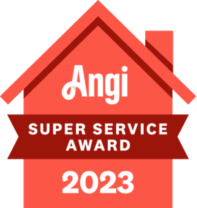 Red house-shaped 2023 service award badge.